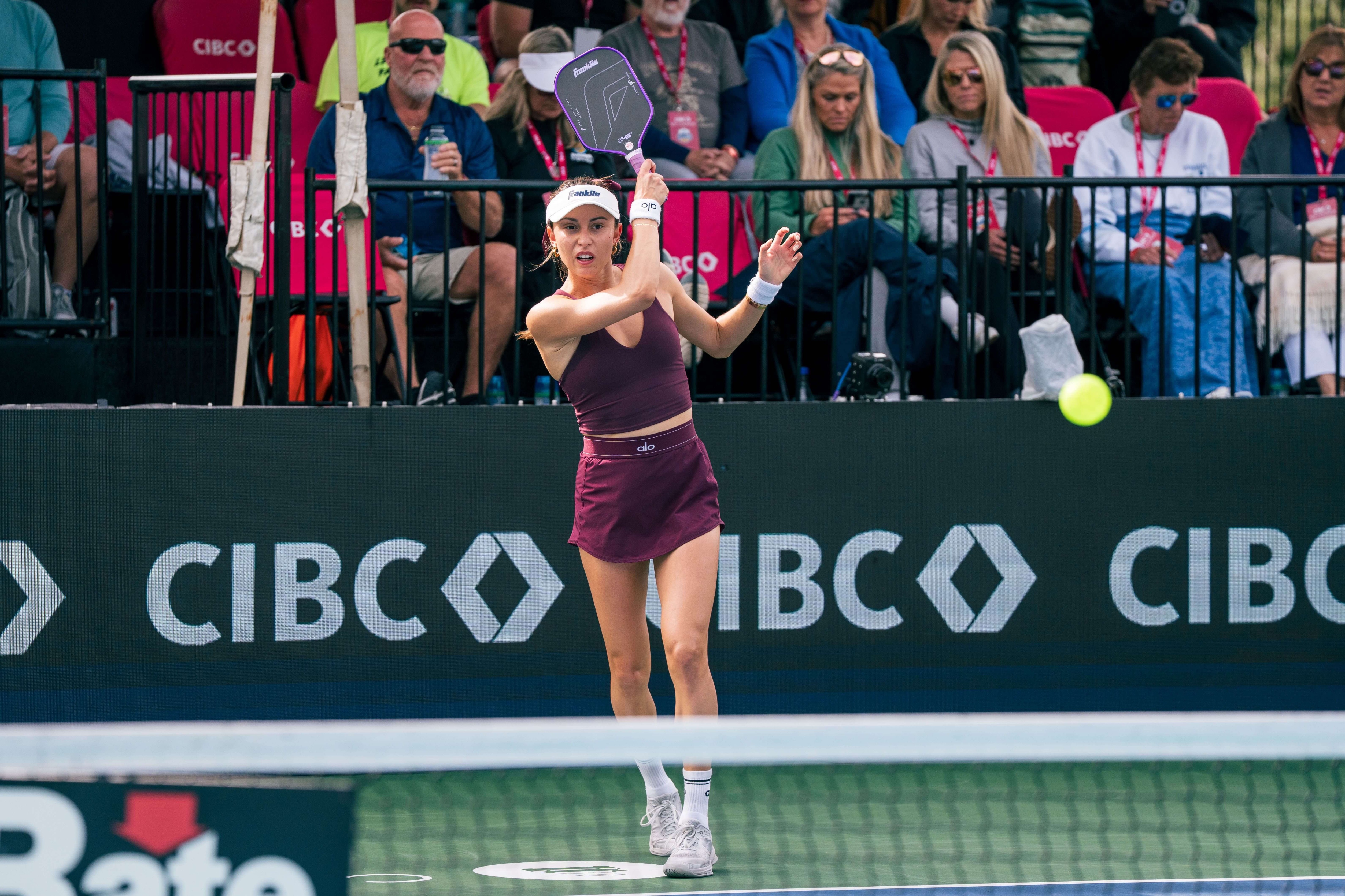Todd in dark red matching skirt and tank top